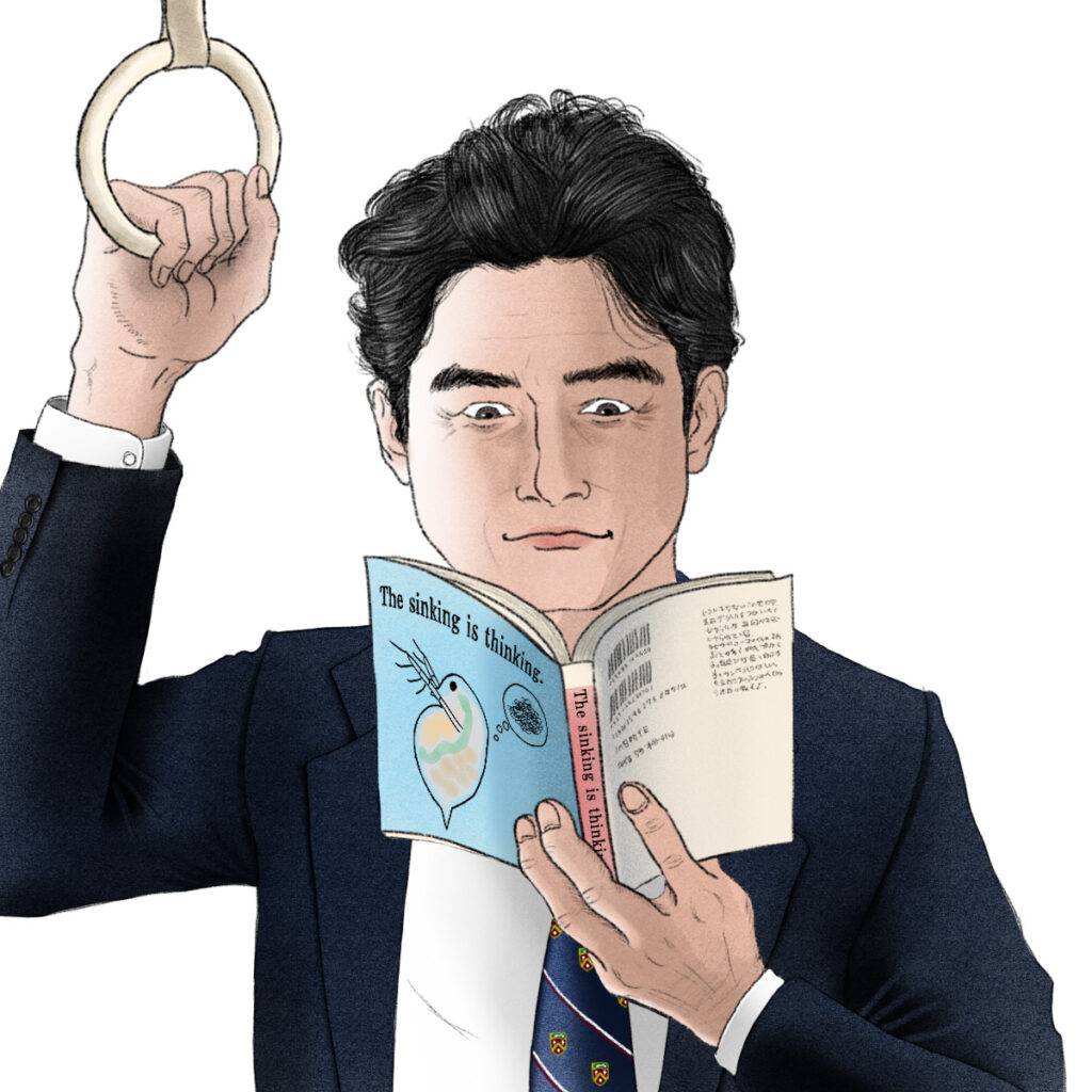 電車で本を読むサラリーマン